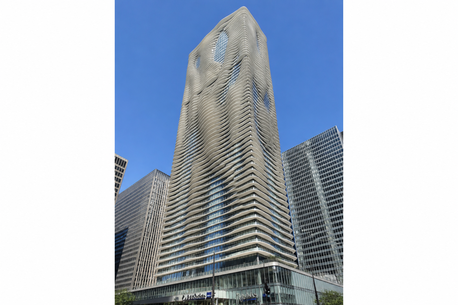 Radisson Blu Aqua, Chicago exterior - a modern hotel tower on the Chicago River waterfront in Lakeshore East
